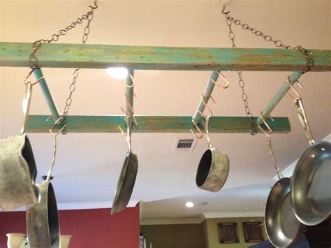 Old wood ladder distressed and painted. Hang and use as a pot rack