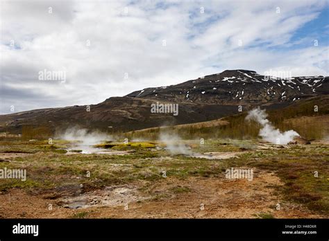 Steam Rising From Geothermal Hotspots And Small Geysers At Geysir Site