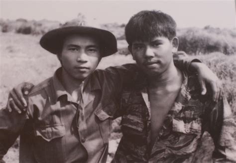 North And South Vietnamese Soldiers Taking A Picture Together Quang