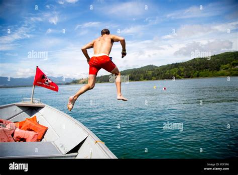 Person Jumping From Boat Hi Res Stock Photography And Images Alamy
