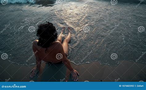 Suntan Beach Woman Tanning Legs Relaxing Swimming In Ocean Water With