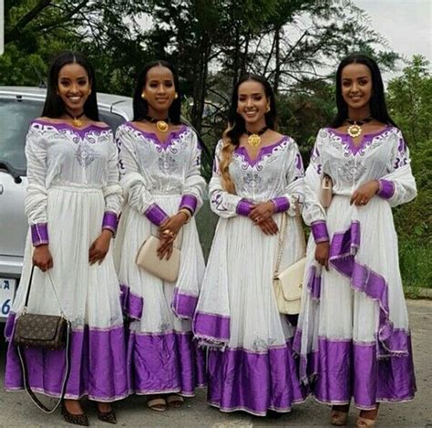 Ladies In Beautiful Purple And White Habesha Kemis Traditional Attire