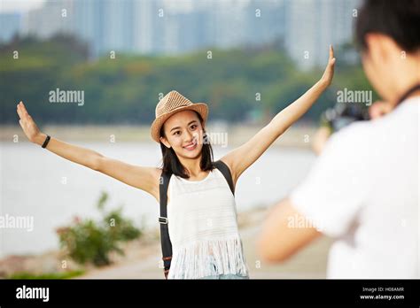 Young Couple Tourists Taking A Travel Photo Stock Photo Alamy