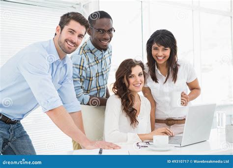 Happy Coworkers Working Together With Laptop Stock Image Image Of