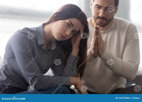 Young Husband Beg Offended Wife For Forgiveness Stock Image