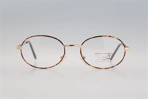 sisley sly 244 12m vintage 90s gold and tortoise small oval etsy in 2021 oval eyeglasses cute