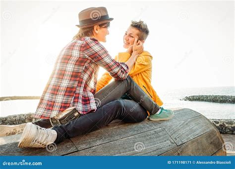 Happy Gay Couple In Romantic Date On The Beach Young Lesbians Having A Tender Moment Outdoor