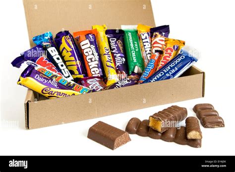 A Box Of Cadbury And Frys Chocolate Bar Selection With Opened Stock