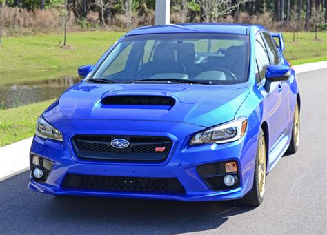 This car has automatic transmission, a 4 cylinder engine, 18″ wheels and black interior. 2015 Subaru WRX STI Review & Test Drive