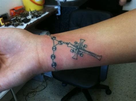 Wrist tattoos look keen and on the off chance that it happens to be a cross tattoo, it will grant alternate importance to your picture meaningful quote on wrist Tribal Tattoo Designs: 3 Feminine Rosary Tattoos On Wrist ...