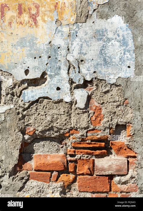 Old Damaged Brick Wall With Plaster Falling Off Stock Photo Alamy