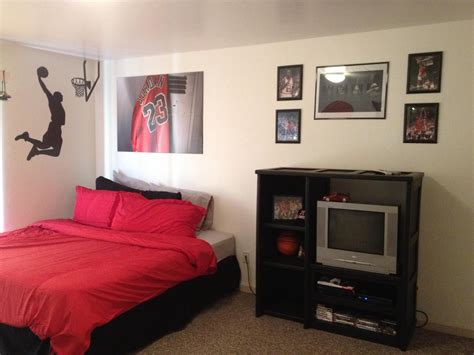 This boys bed features a bunk bed finished in navy blue paint, pairing up with the side table and shelving. My 13year old's Michael Jordan Room! | Futon living room ...