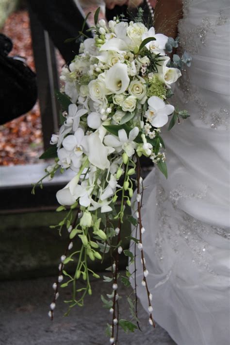 exquisite  white winter wedding featuring  divine cascade wedding bouquet flowers wedding