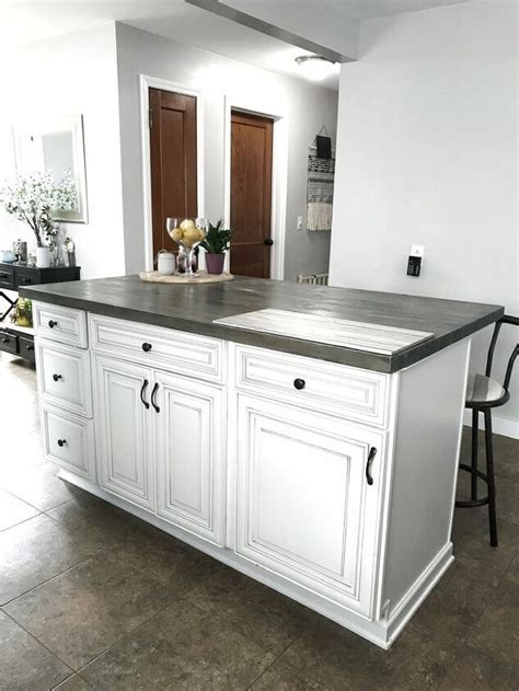 These old wooden cabinets and hardware made the room appear dark and dated. DIY Kitchen Island With Stock Cabinets | Hometalk