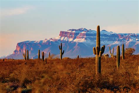 Sunset Light On The Snow Covered Superstition Mountains Photograph By