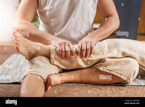 Thai Body Relaxing Massage Masseur Giving A Traditional Thai Leg