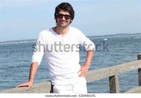 Portrait Of Handsome Young Man At Sea Resort