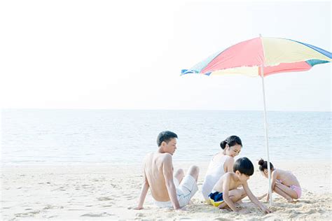 Japanese Girl Sitting At The Beach Stock Photos Pictures And Royalty