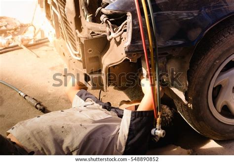 Mechanic Uniform Lying Down Working Under Stock Photo 548890852