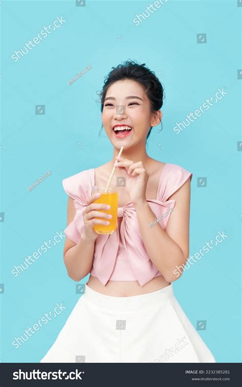 Woman Who Drinks Orange Juice Stock Photo 2232385281 Shutterstock