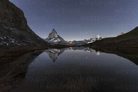 Matterhorn Reflection In Riffelsee Lake In A Starry Night Gornergrat