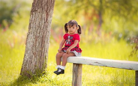 Girl Wearing Pink Floral Short Sitting On White Wooden Bench Hd