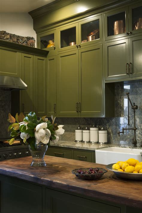 Green is a color choice that suggests health, and it can be both vibrant and soothing. Windowless kitchen with olive green cabinetry, beautiful ...