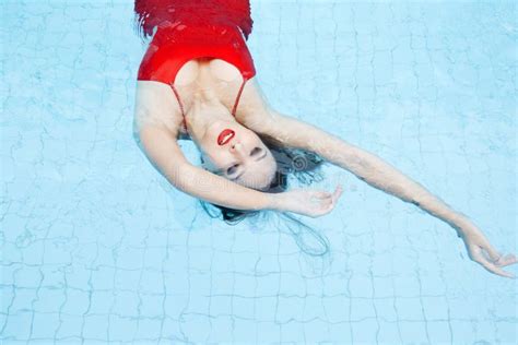 Woman In A Red Dress Swimming In The Pool Stock Image Image Of Hair