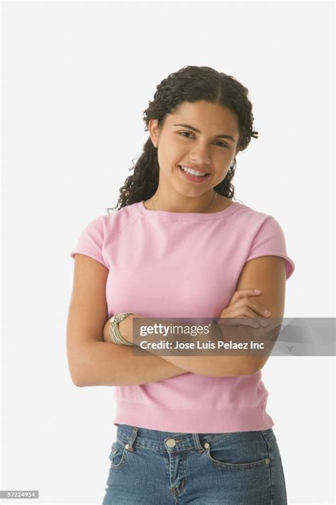 Teenage Girl Standing With Arms Crossed High Res Stock Photo Getty Images