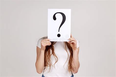 Anonymous Woman Hiding Her Face Behind White Paper With Question Mark