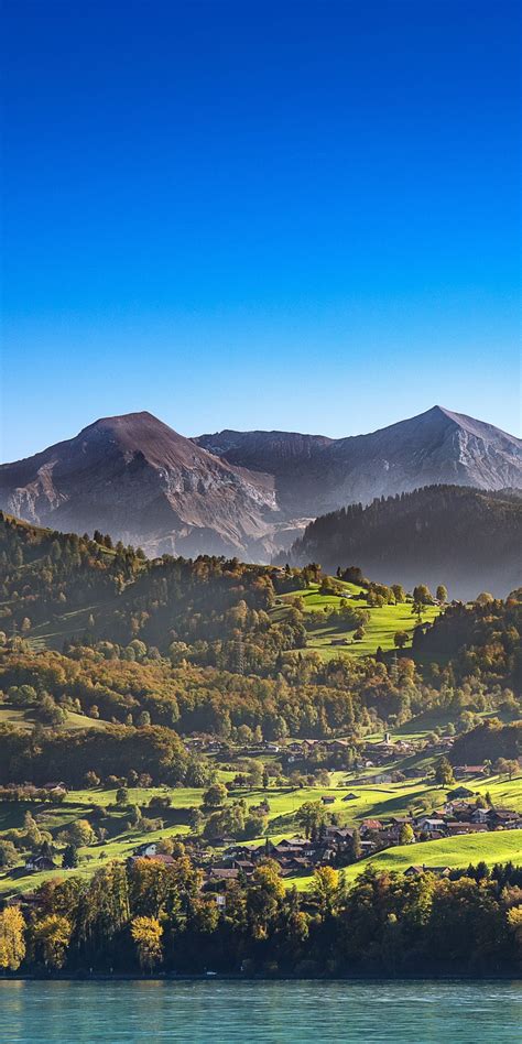 Download Wallpaper 1080x2160 Sunny Day Mountains Landscape Blue Sky
