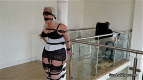 Corset And Girdle Clad MILF In Strict Leather Strap Pole Predicament