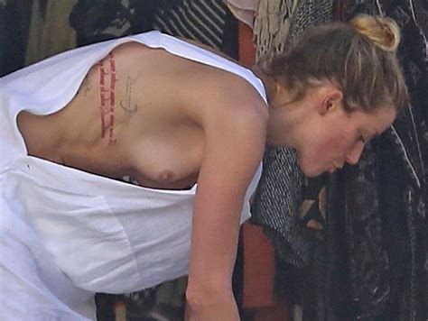 Amber Heard Braless Boobs Pop Out Nip Slip While Cleaning Out Her