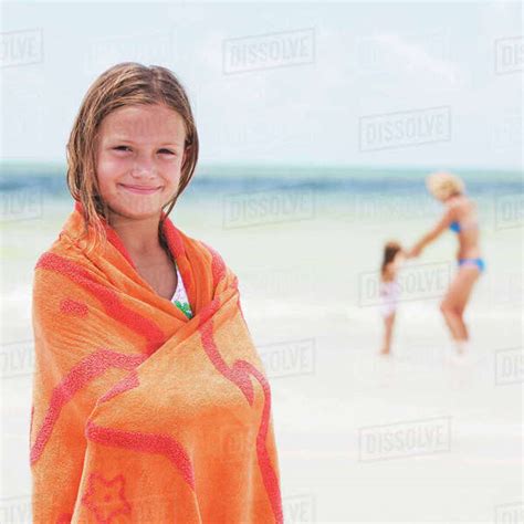 Girl Wrapped In Towel On Beach Stock Photo Dissolve