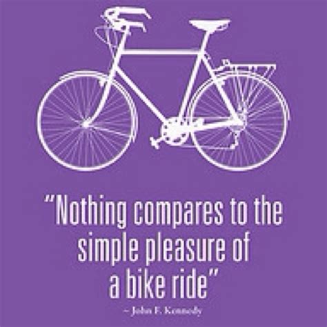 A Purple Background With A White Quote From John F Kennedy On A Bicycle