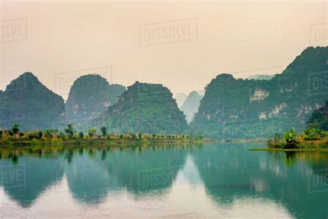 karst-mountain-landscape-at-sunset,-ninh-binh,-vietnam-stock-photo