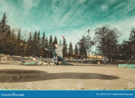 Guy Doing Skateboarding Tricks At The Skatepark Stock Photo Image Of