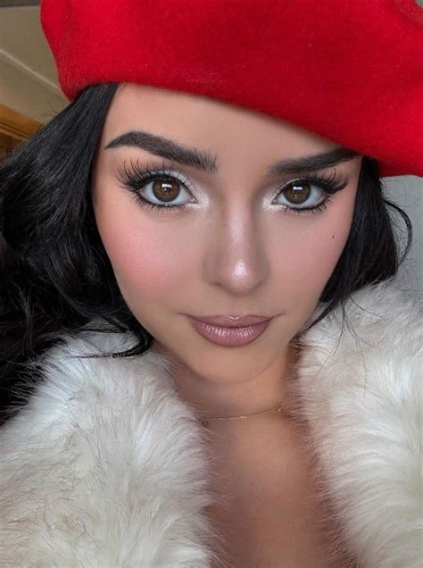 demi rose radiates fairytale glamour a disney princess moment in a furry coat and red hat