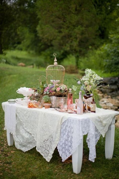Drape Tables In Layers Of Table Cloths Lace And Top With Flowers In