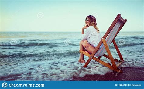 Pretty Woman Relaxing On A Lounger Beach Summer Vacation Concep Stock
