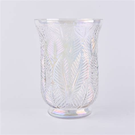 A crate and barrel classic, these handcrafted glass hurricanes, look as beautiful reflecting candlelight as they do filled with twinkling garlands or terrarium plantings. Large pearl white hurricane glass candle holder wholesale