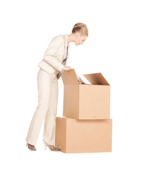 premium photo picture of attractive businesswoman unpacking big boxes