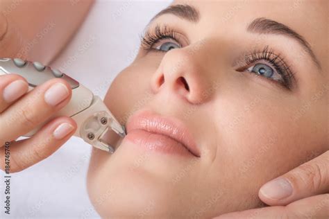 Rejuvenating Facial Treatment Model Getting Lifting Therapy Massage In A Beauty Spa Salon