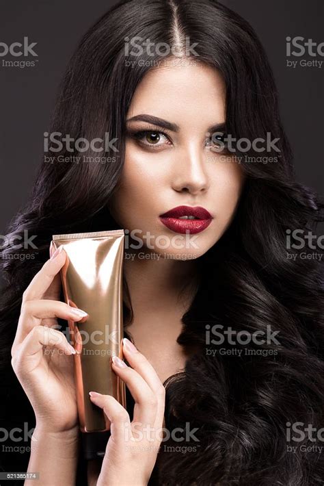 Beautiful Brunette Model Curls Classic Makeup And Red Lips Stock Photo