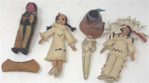 lot collection of native american dolls and 3 toy birch bark canoes