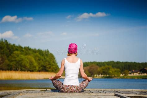 Meditation And Yoga Practicing Near The Lake Stock Photo Image Of