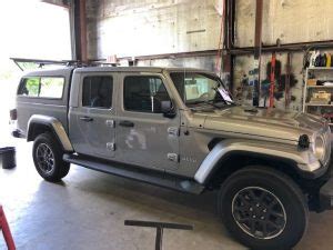 The 60 steel corebar crossbars are a nice strong aerodynamic design. Jeep Gladiator Camper Shell Install - Stonestrailers