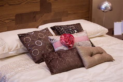 Beautiful Decorative Pillows On The Bed In The Luxury Bedroom Stock