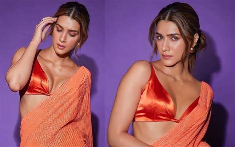 Kriti Sanon Gets Trolled For Donning An Orange Sequin Saree With A Deep Neckline Blouse