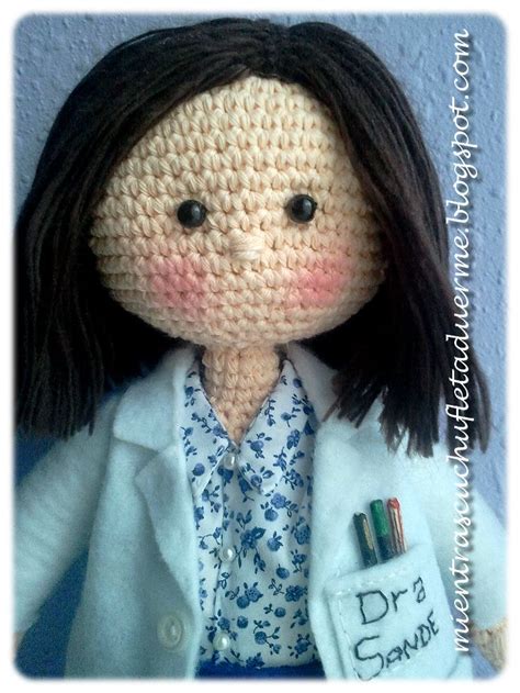 A Crocheted Doll Wearing A Lab Coat